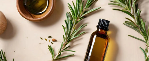 Rosemary oil bottle with fresh rosemary sprigs and a wooden comb, showcasing natural ingredients for hair care- dazze and blussh